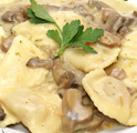 Ravioli with ham and cheese in a mushroom sauce